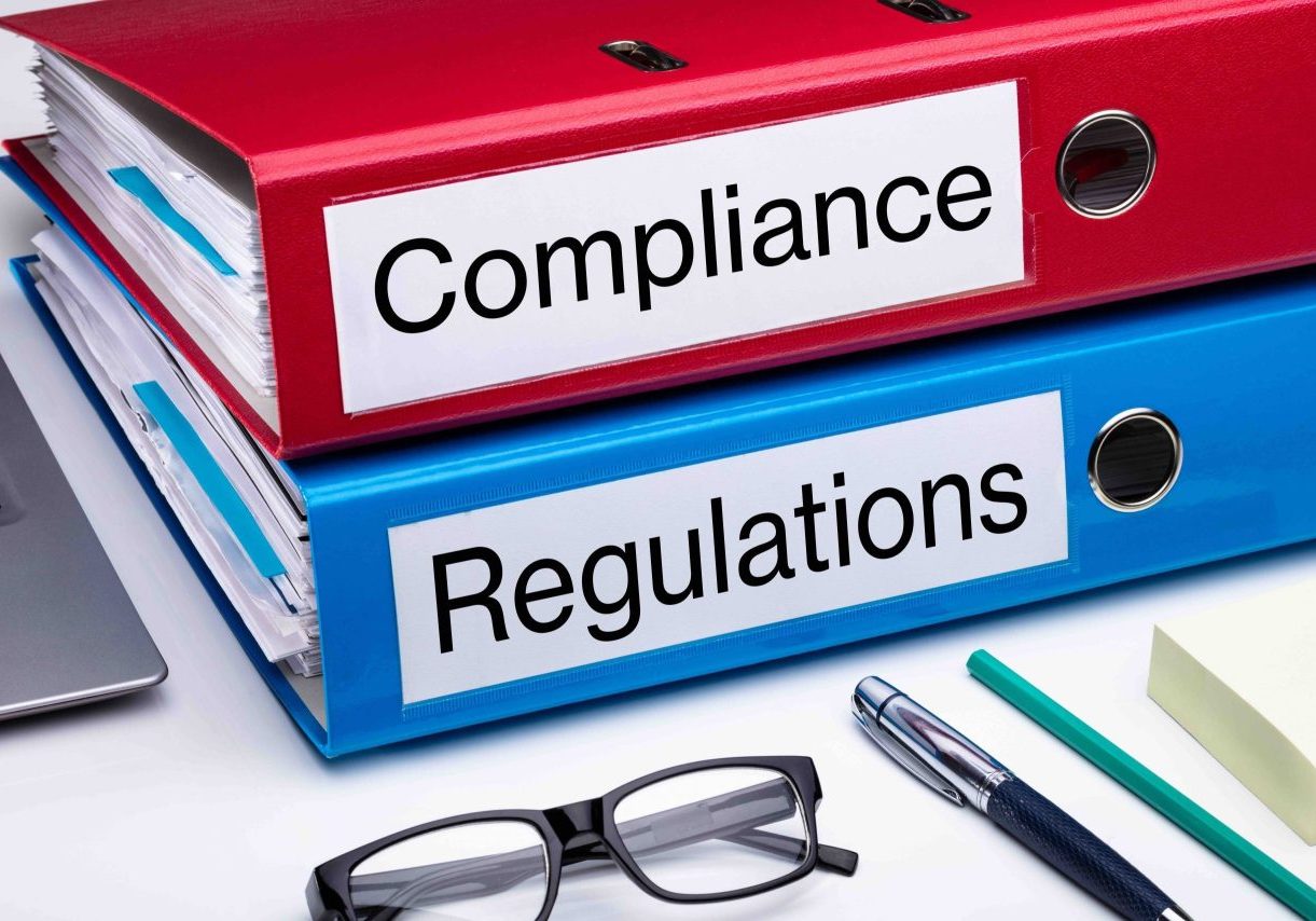 Compliance And Regulation Folder On Office Desk Compliance And Regulation With Office Supplies Over Business Desk